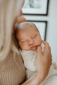 Mom holding baby in home for photo session in Santa Monica, CA.