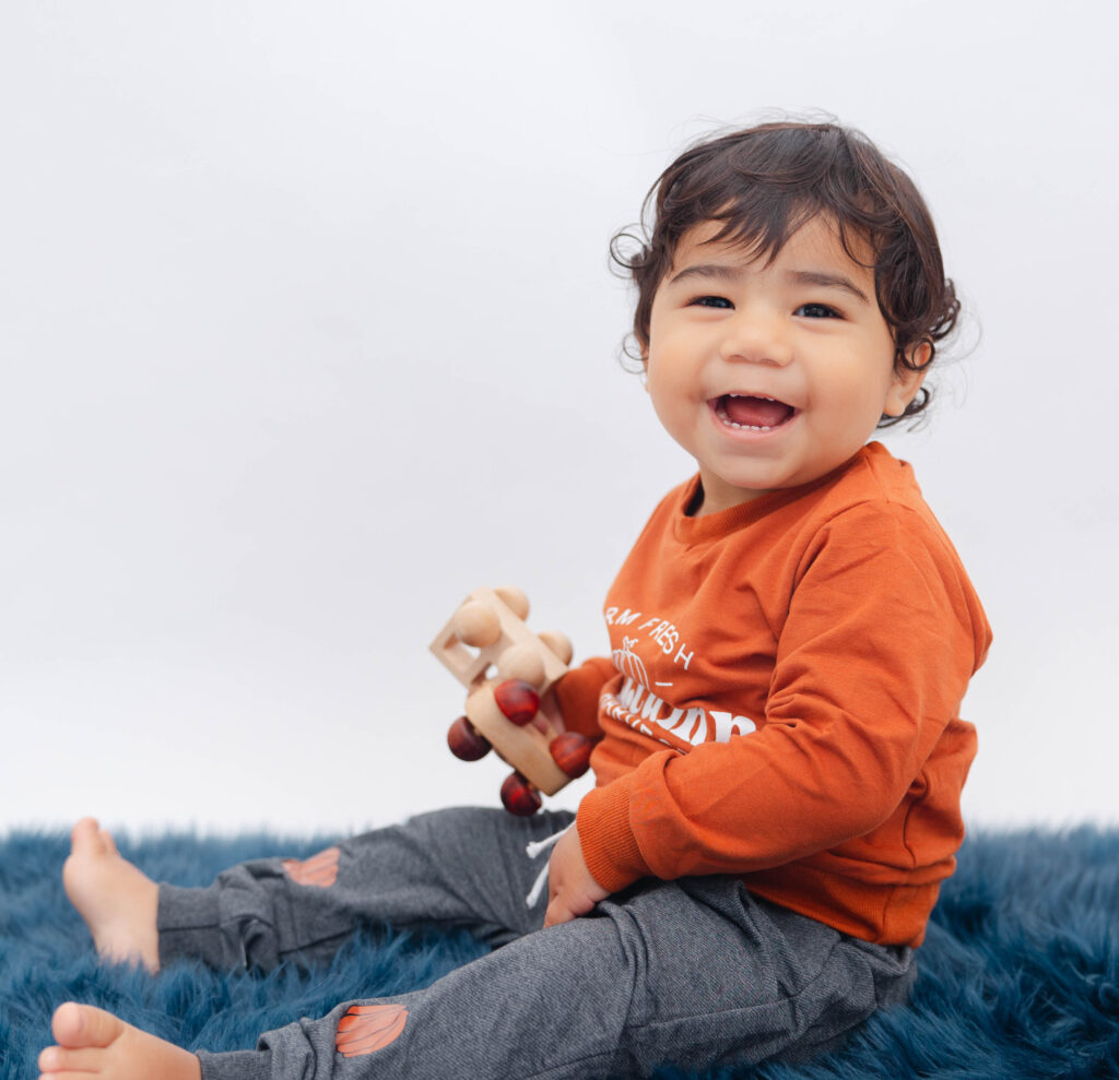 Two year old posing for his family portrait session at Heather Nicole Photography.