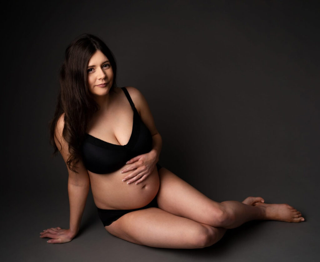 Studio session of pregnant mom wearing black panties and bra at Heather Nicole Photography in Redondo Beach, CA